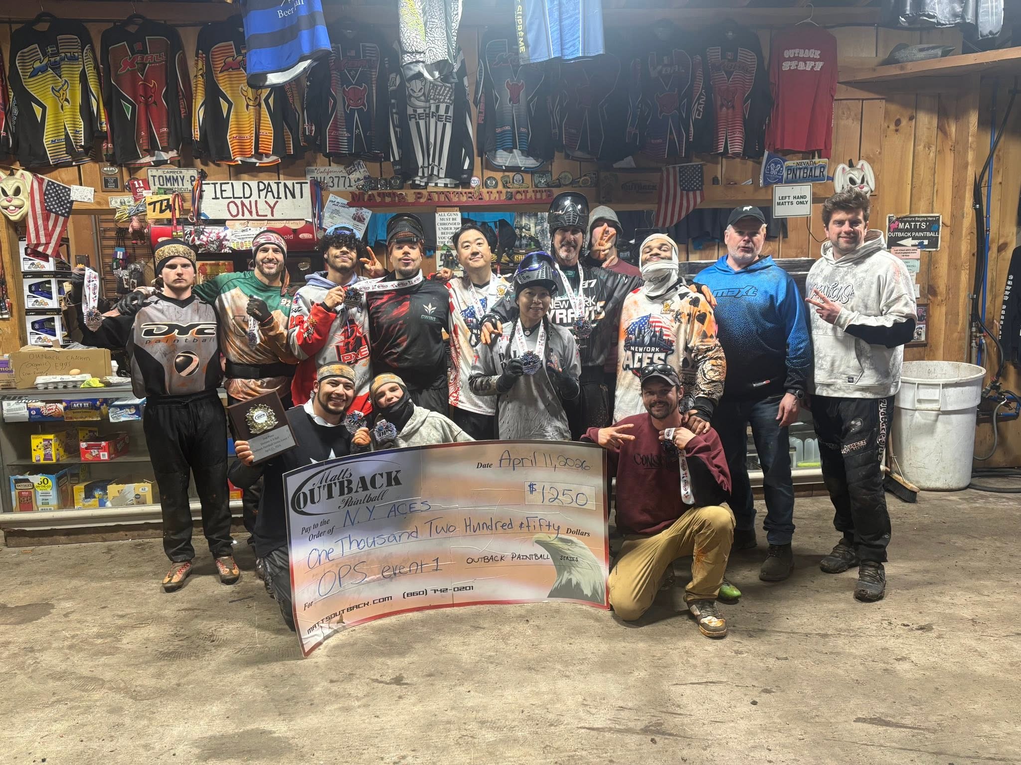 NY ACES team celebrating OPS Event 1 win with check at Matts Outback pro shop