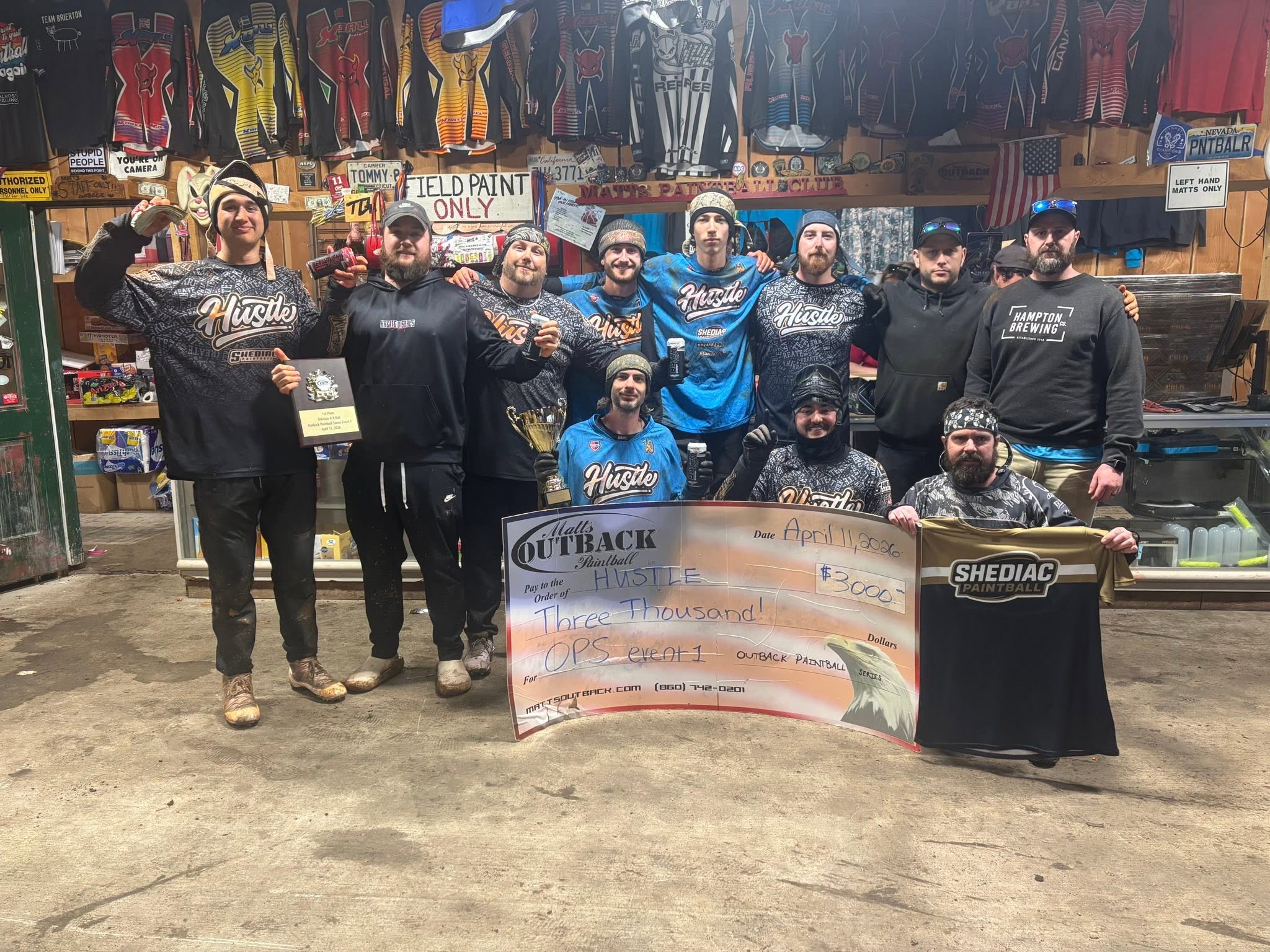 Team Hustle with $3000 check after OPS Event 1 at Matts Outback Paintball