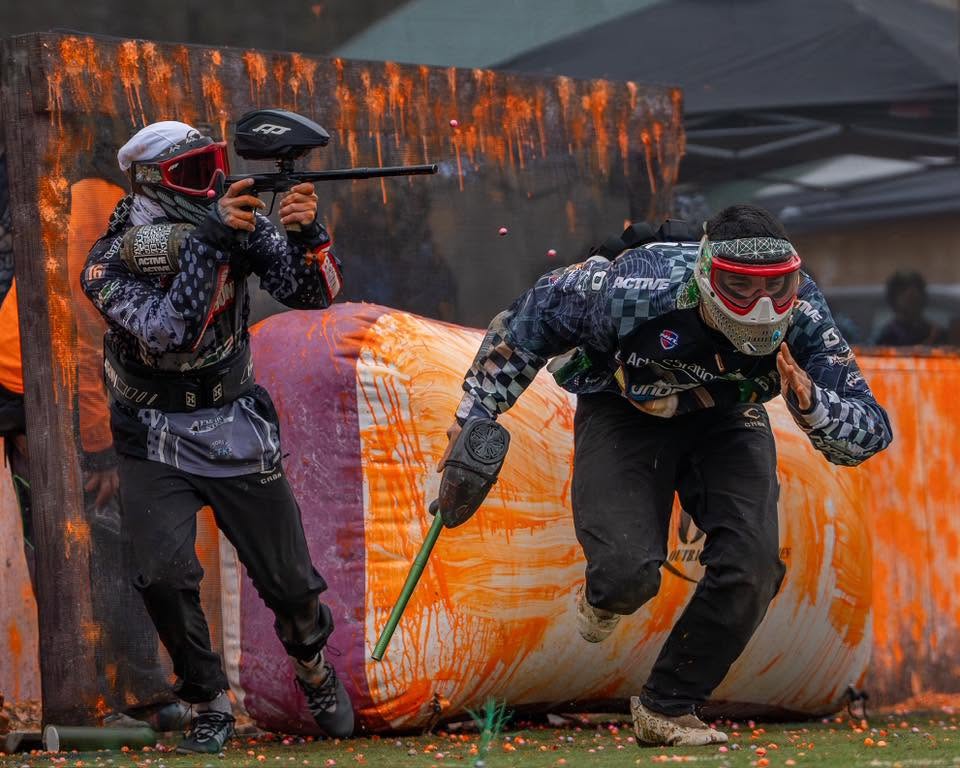 Players trading paint off orange bunkers on the OPS speedball field